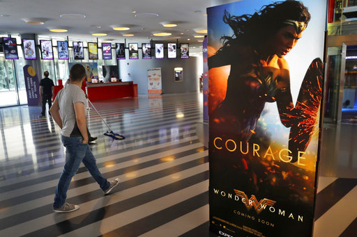 A man walks past a poster promoting the movie