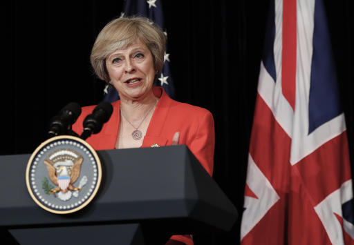 British Prime Minister Theresa May talks to media with U.S. President Barack Obama after their bilateral meeting in Hangzhou in eastern China's Zhejiang province