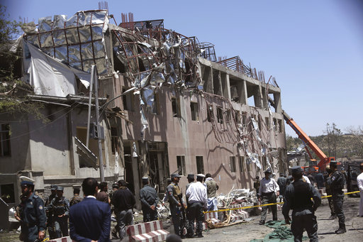 Security forces inspect near the site of an explosion in Kabul