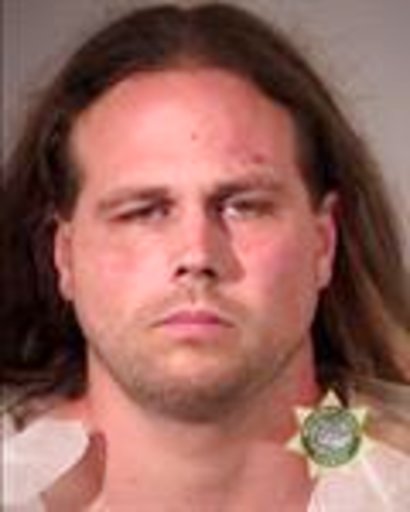 This booking photo provided by Multnomah County Sheriff's Office shows Jeremy Joseph Christian. Authorities on Saturday