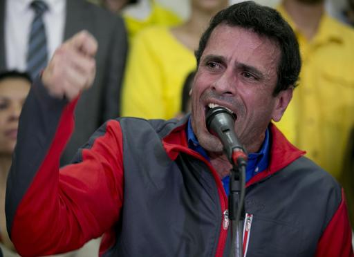 Opposition leader Henrique Capriles speaks during a press conference