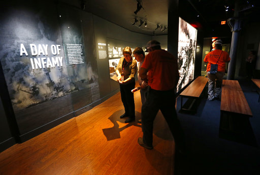 Workers go over the final installation of the permanent exhibit "Salute to the Home Front" at the National World War II Museum which will open to the public this Saturday
