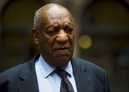 Bill Cosby speaks to the media as he and his attorney leave Allegheny County Courthouse after the third day of jury selection in his sexual assault trial in Pittsburgh on Wednesday