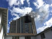 Smoke billows from a high-rise apartment building in Honolulu