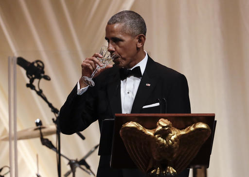 President Barack Obama toasts to Italian Prime Minister Matteo Renzi during a State Dinner on the South Lawn in the White House in Washington