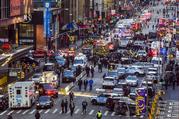 Law enforcement officials work following an explosion near New York's Times Square on Monday