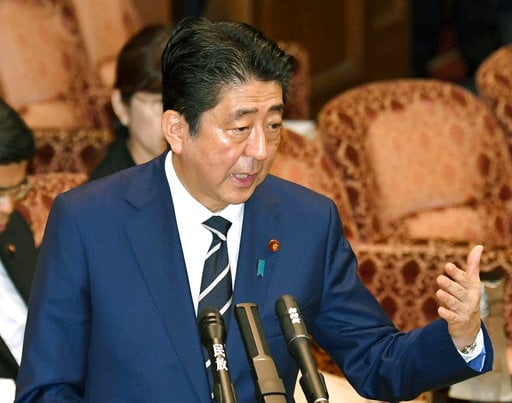 UPDATES SECOND SENTENCE - Japanese Prime Minister Shinzo Abe answers a question during a session of the Upper House Budget Committee in Tokyo Tuesday