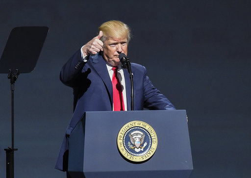 President Donald Trump gives a thumbs-up as speaks at the National Rifle Association-ILA Leadership Forum