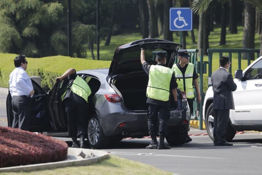 A car is checked at the entrance to the presidential official residence Los Pinos in Mexico City