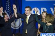 Virginia Gov.-elect Ralph Northam celebrates his election victory with his wife Pam and daughter Aubrey