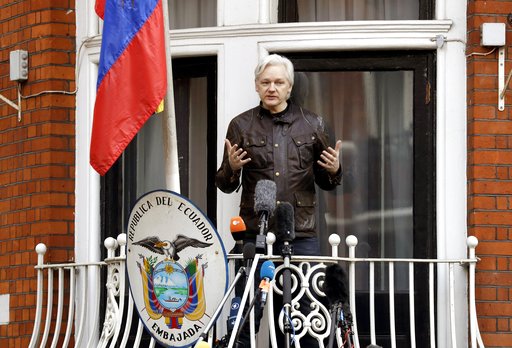 WikiLeaks founder Julian Assange gestures as he speaks on the balcony of the Ecuadorian embassy