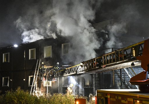 Firefighters extinguish a fire that broke out during the night Sunday Oct. 16