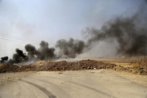 Smoke rises from Islamic state positions after an airstrike by coalition forces in villages surrounding Mosul