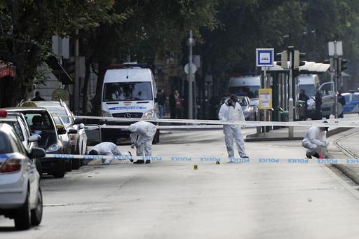 Police forensic experts examine the scene in central Budapest