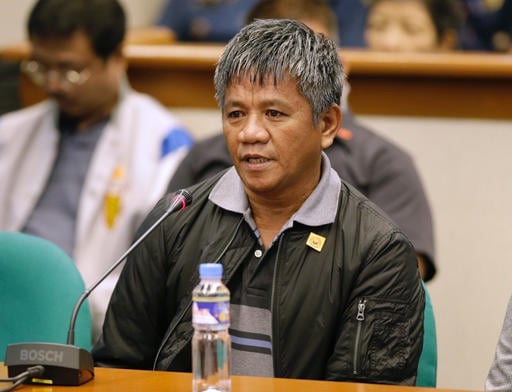 Former Filipino militiaman Edgar Matobato answers questions as he testifies before the Philippine Senate in Pasay