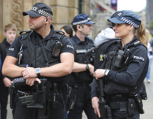 Armed response police stand at the start of the Great Manchester Run in central Manchester