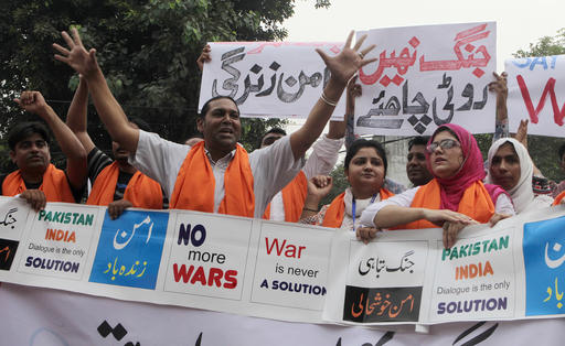 Members of the Pakistani Civil Society Forum chant slogans during a demonstration for peace and condemning the raising tension between Pakistan and India