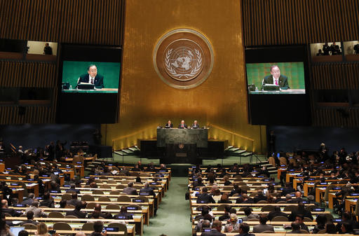 United Nations Secretary-General Ban Ki-moon speaks as President of the 71st session of the General Assembly Peter Thomson