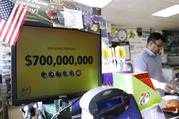 A Powerball lottery sign displays the lottery prizes at a convenience store Wednesday
