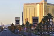 Police block a road on the Las Vegas Strip near the Mandalay Bay hotel and casino shortly after sunrise Monday