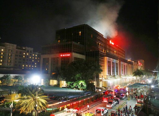 Smoke rises from the Resorts World Manila complex early Friday