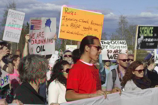 A few hundred people chanted slogans and made speeches to protest the presence of U.S. Secretary of State Rex Tillerson in Fairbanks