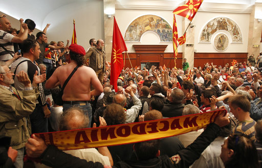 Protestors enter into the parliament building in Skopje