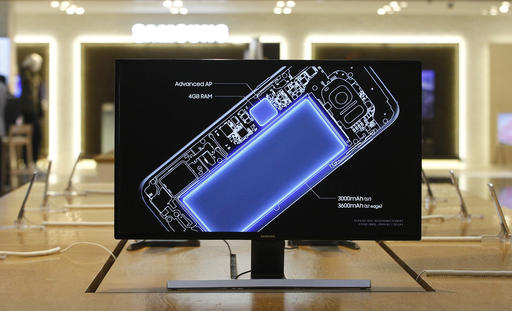 A screen shows an internal design drawings of Samsung Electronics Galaxy S7 smartphone at its shop in Seoul