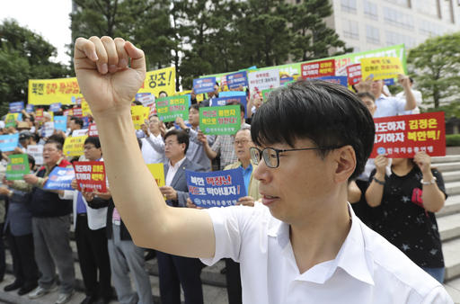 South Korean shout slogans during a rally denouncing North Korea's latest nuclear test in Seoul