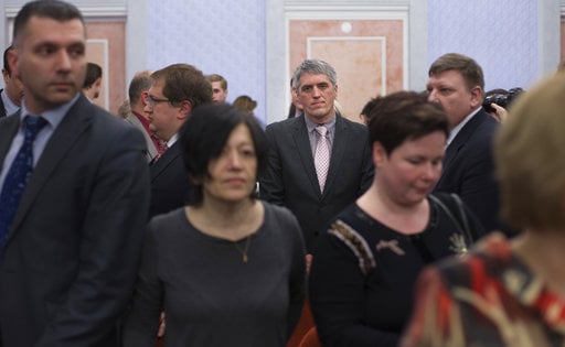 Members of Jehovah's Witnesses react in a court room after judge's decision in Moscow