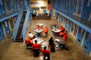 Inmates inside Albany County jail's veteran's pod gather for a group session with Sarah Polidore