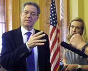 Kansas Gov. Sam Brownback talks to reporters