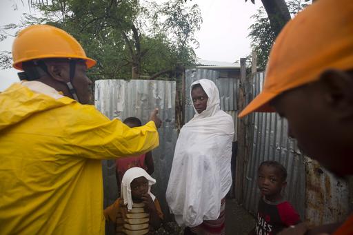 A man from civil protection asks residents to evacuate their homes located near the the Grise river