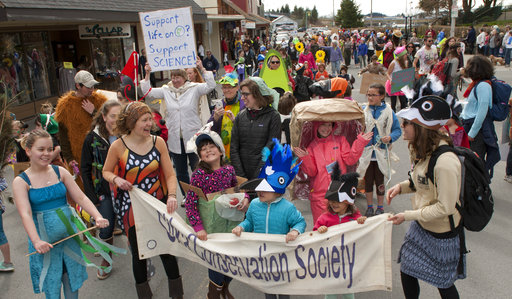 Dozens of Sitkans dressed as their favorite animals march in the annual Parade of Species on Lincoln Street in Sitka