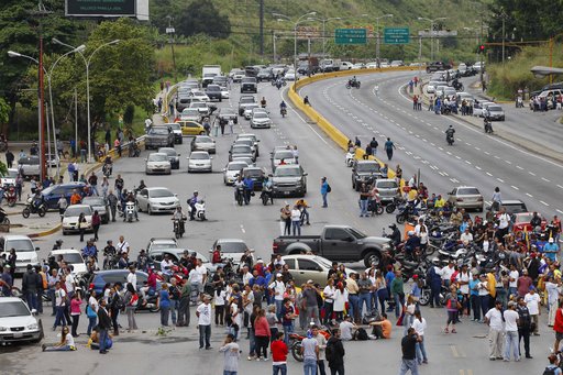 People block a highway in Caracas
