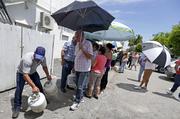 Residents stand in line to purchase propane gas as they prepare for Hurricane Irma