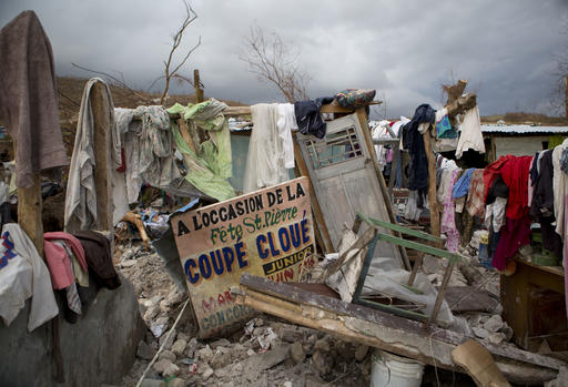 Salvaged clothes are hung to dry on the remains of a home destroyed by Hurricane Matthew