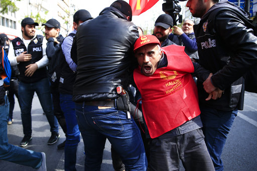 Police arrest demonstrators as they march during May Day