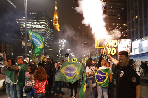 Demonstrators celebrate the decision by Judge Sergio Moro to convict former Brazilian President Luiz Inacio Lula da Silva
