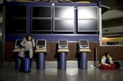 Passengers wait after the lights went out at Hartfield-Jackson Atlanta International Airport