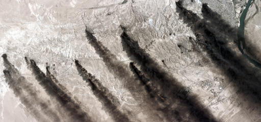 This satellite image provided by PlanetLabs via AllSource Analysis shows oil fields burning in the Qayara oil field on Aug. 26