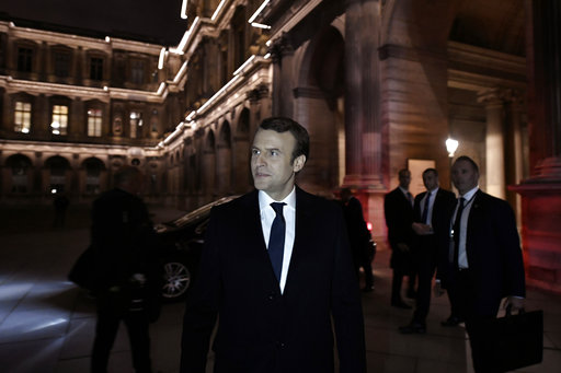 Incoming French President Emmanuel Macron leaves the Louvre Museum after addressing his supporters in Paris
