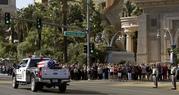The funeral procession for Las Vegas police officer Charleston Hartfield passes Mandalay Bay on the Las Vegas Strip Friday