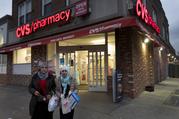 Customers leave a CVS Pharmacy