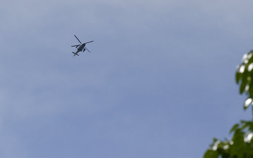A helicopter hovers over the site as government troops continue to battle Muslim militants