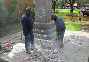 Workers begin removing a Confederate statue in Gainesivlle