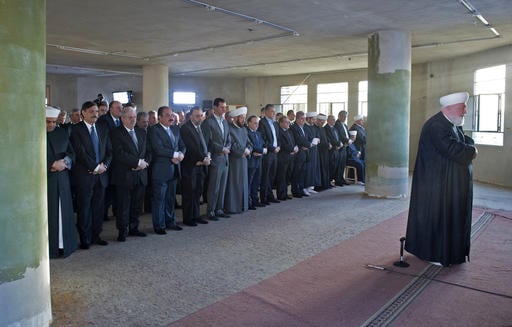 In this photo released on the official Facebook page of the Syrian Presidency