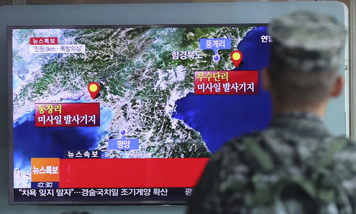 A South Korean marine watches a TV screen reporting about North Korea's possible nuclear test at the Seoul Railway Station in Seoul