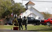 Law enforcement officials continue to investigate the scene of a shooting at the First Baptist Church of Sutherland Springs
