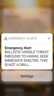 This smartphone screen capture shows a false incoming ballistic missile emergency alert sent from the Hawaii Emergency Management Agency system on Saturday